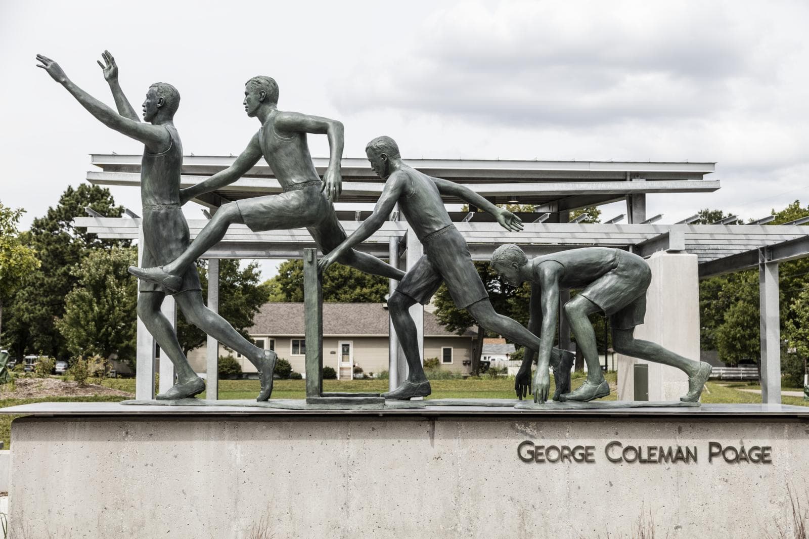 Bronze George Coleman Poage hurdling sculpture in Poage Park