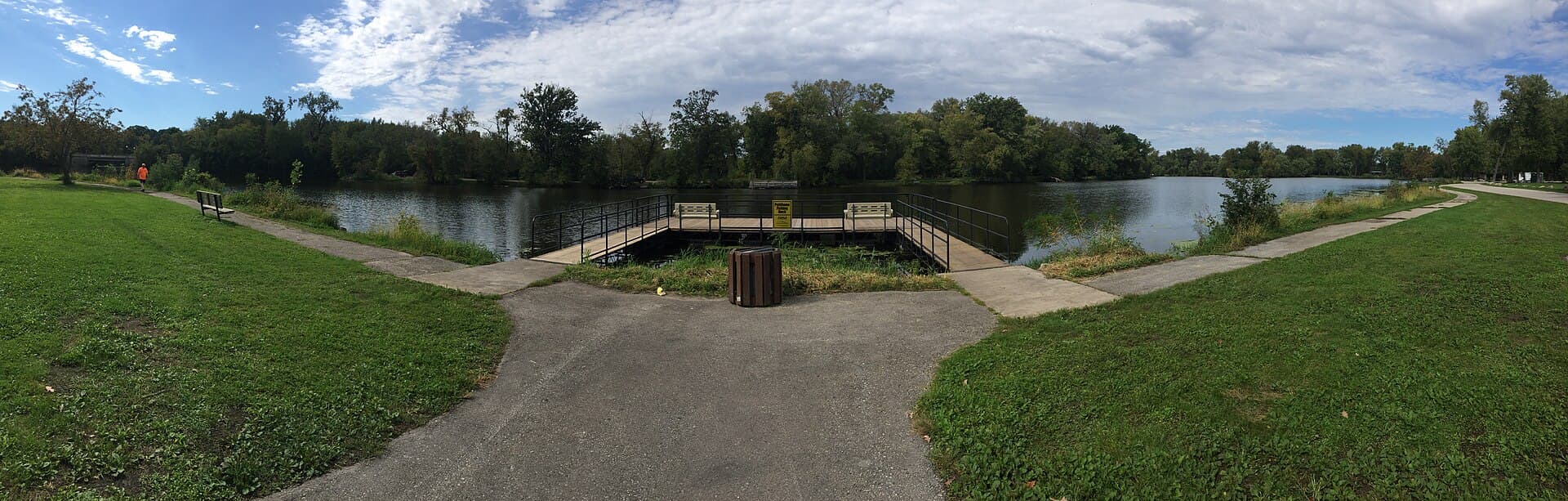 Fishing platform, paths, lawn, and lagoon shoreline at Pettibone Park